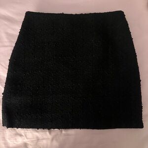 Short black textured mini skirt